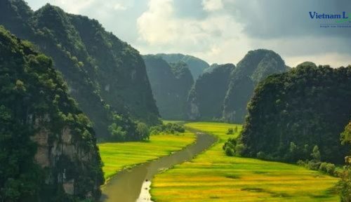 Tam Coc, where emerald rice paddies, meandering rivers.